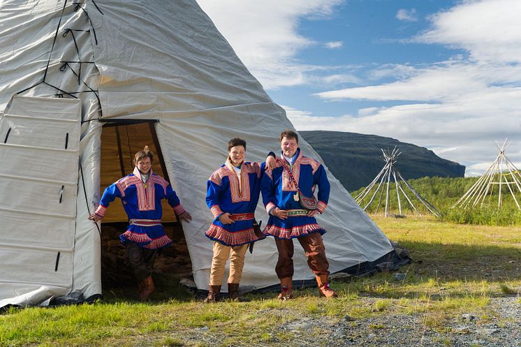 Alta - Sami outside the lavvu-Photo - CH  - VisitNorway.com.jpg