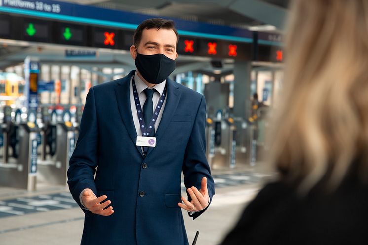 Tom Easdown, station manager at London Bridge, offers help to a returning customer