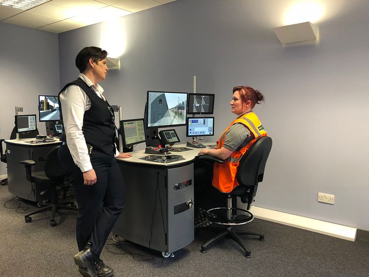 Polly McGillivray and Laura McDonald training on the sim desk