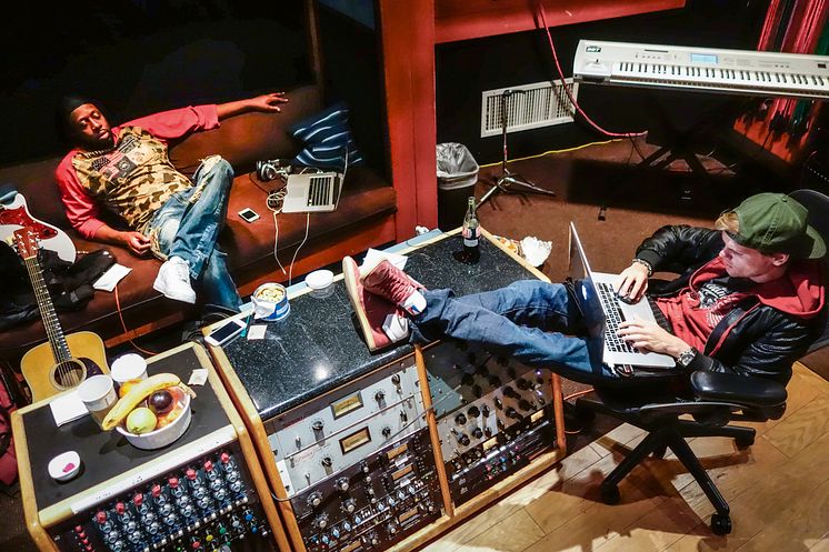 Tim “Avicii” Bergling in the studio with Wyclef Jean