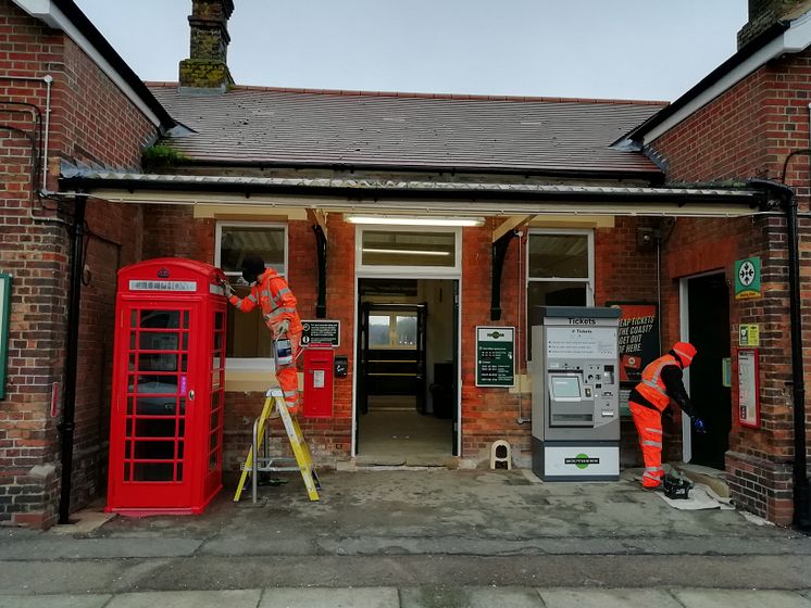 Workmen refurbish the street-level ticket hall