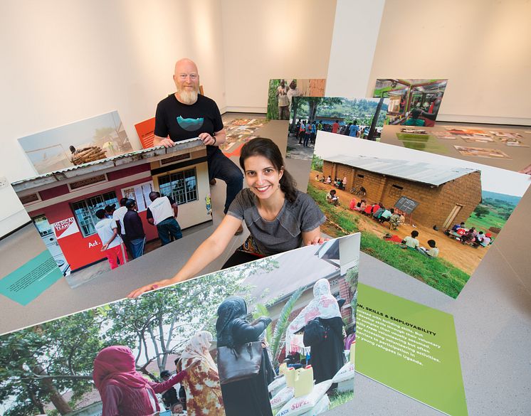 Professor Matt Baillie Smith and Dr Bianca Fadel help install the RYVU exhibition at Gallery North