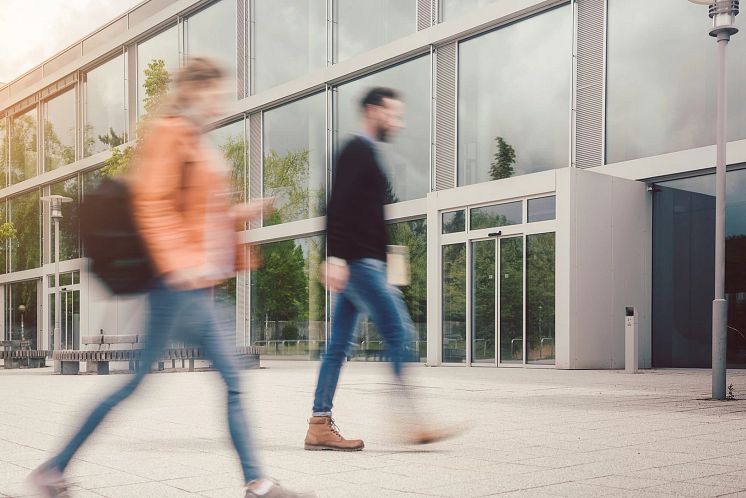 blurred-silhouette-of-students-being-busy-on-university.webp