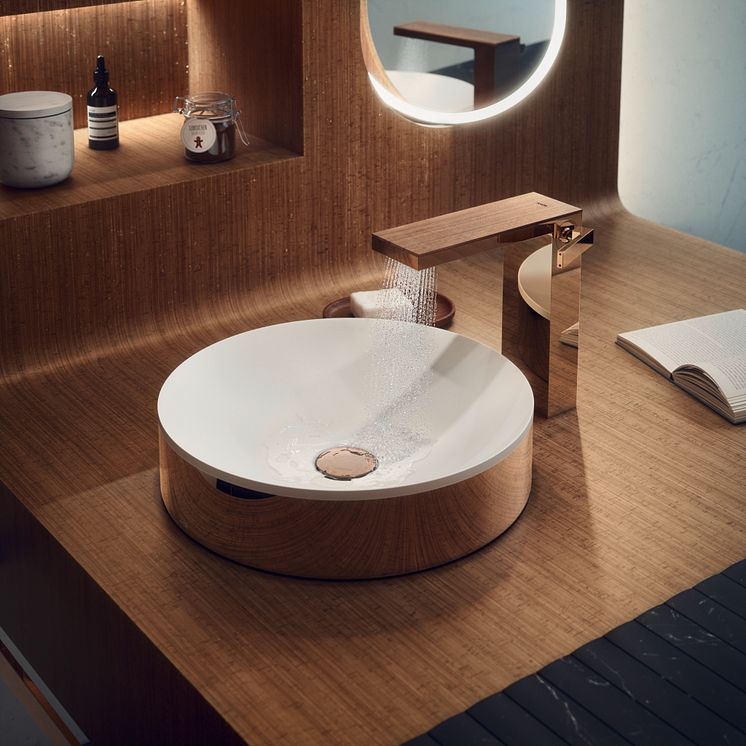 AXOR Suite round washbasin encased in polished red gold