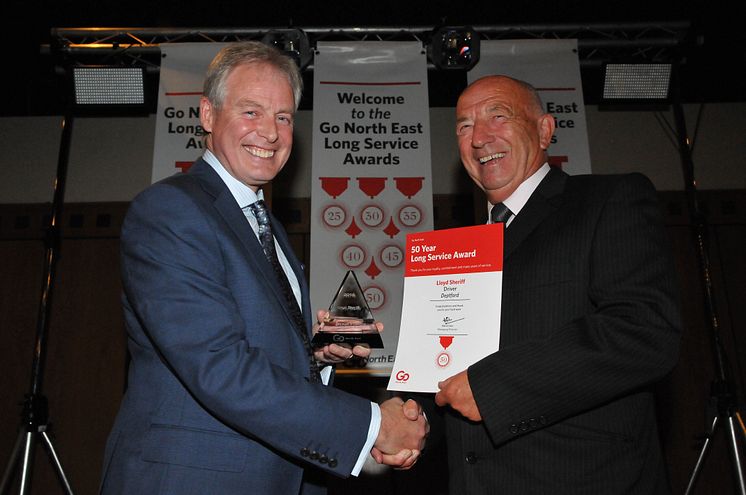 Lloyd Sheriff (right) receives his certificate and trophy from Kevin Carr