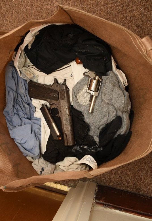 Image of loaded gun and revolver from Heyford Ave