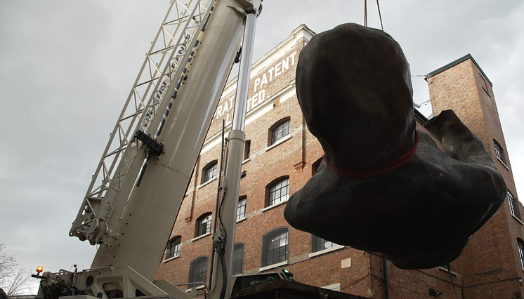 The Mother, one part of the sculpture being lifted in London