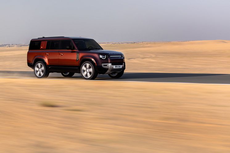 JLR_Reimagine_Product_DEFENDER_130_SEDONA_RED_DUBAI_ON-ROAD_090323_02