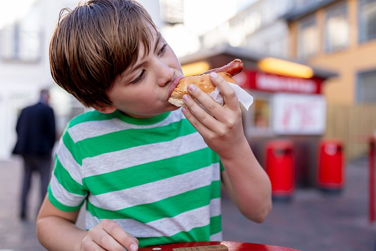 DEST_ICELAND_PEOPLE_BOY_KID_EARTING_HOTDOG_GettyImages-1162048306_Universal_Within usage period_90050