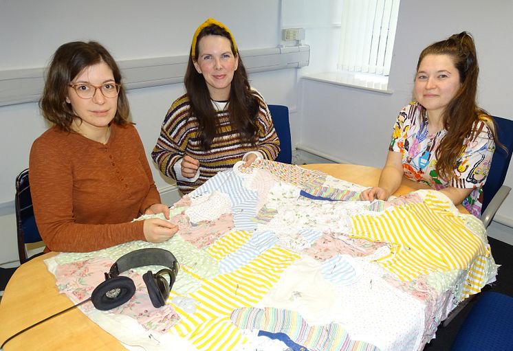 Dr Angelika Strohmayer working on the quilt with colleagues from Swansea and Aberystwth Universities