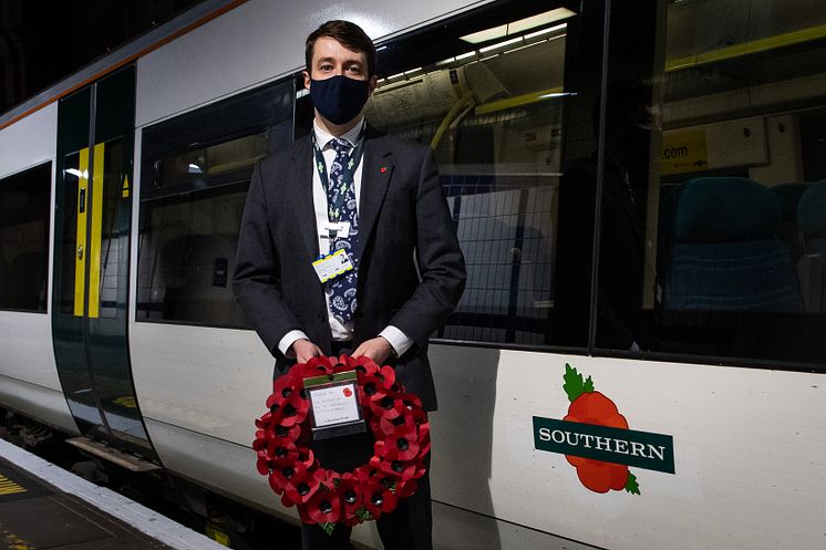 Chris Fowler, Customer Services Director for Southern, welcomes the poppy train into platform 8 (driven by forces veteran, Marc Stoner)