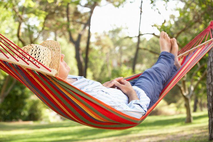 4657864-senior-man-relaxing-in-hammock