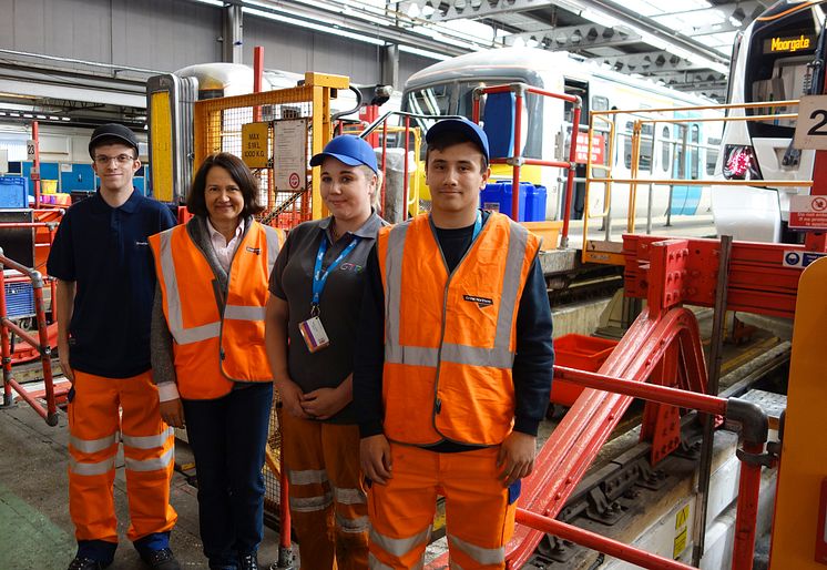 Apprentices (from left) Connor Philpot, Rosie-Jayne Wile and William Webster with MP Catherine West in Hornsey Depot