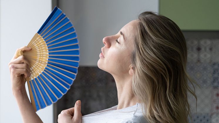 overheated-woman-in-t-shirt-using-wave-fan-suffer-2021-08-31-11-06-37-utc