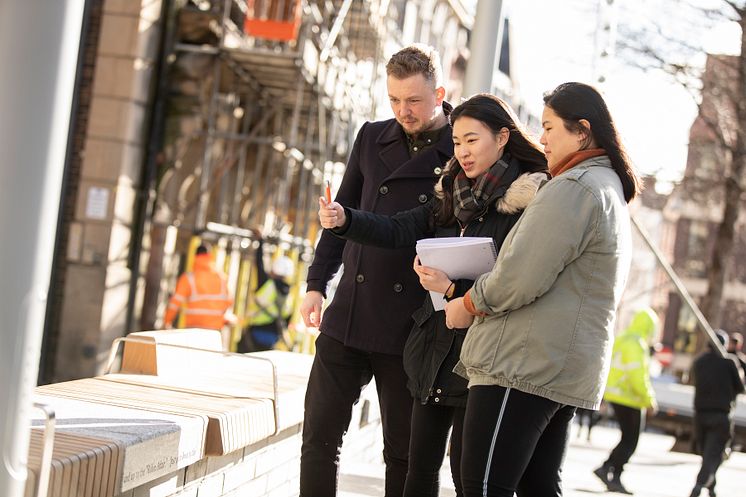 Alex Slack, Bigg Market Project Manager at NE1, pictured with two of the Northumbria students involved in the project,  Chang Shi Qian and Franz Pancho