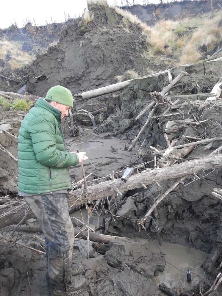 Dr Paul Mann taking samples of permafrost