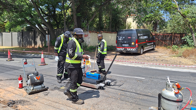 Pothole Patrol reparing the road