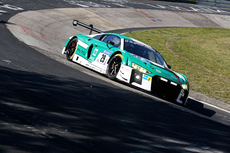 The Land Motorsport Audi charges through the Karussel banking