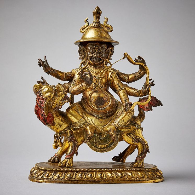 A Tibeto-Chinese gilt bronze figure of Pehar