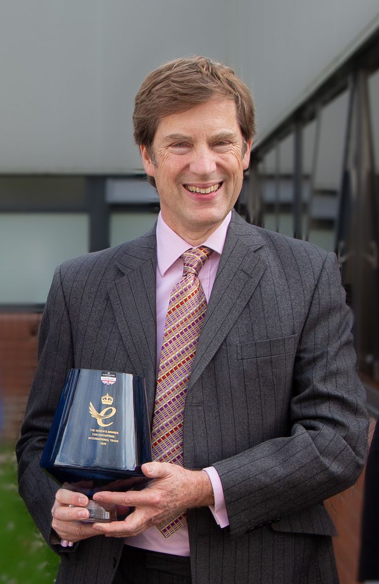 Adrian Dickens receives Queen's Award.png