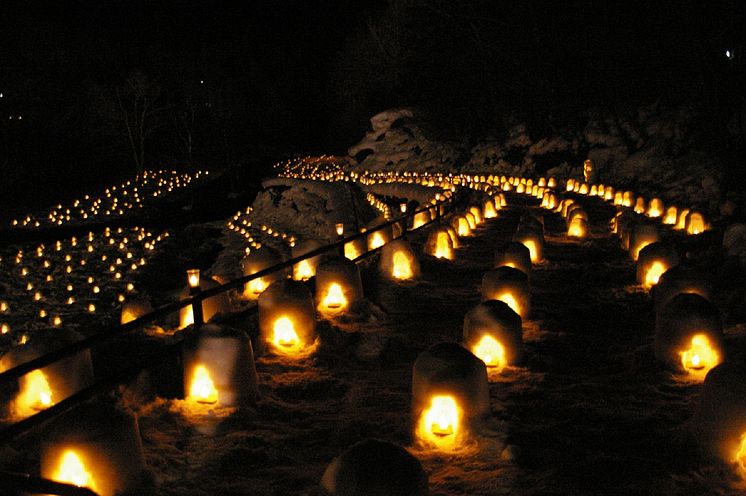 Snow Huts at Yunishigawa Onsen Aglow Past Dusk