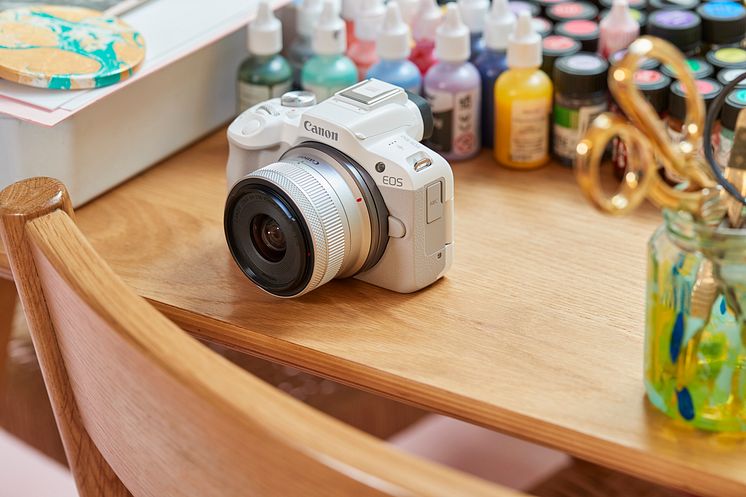 EOS R50-ambient-high-angle-white-camera-marbling-table-paints