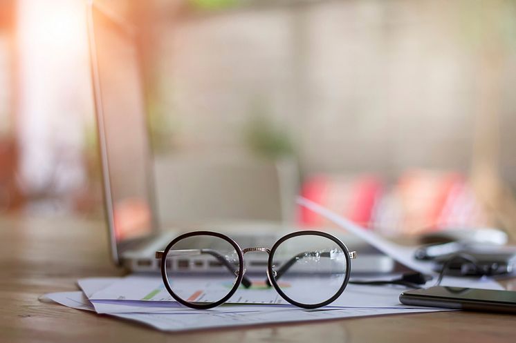 Close-up of Eyeglasses on Desk_Issarapong Suya_GettyImages-728872683