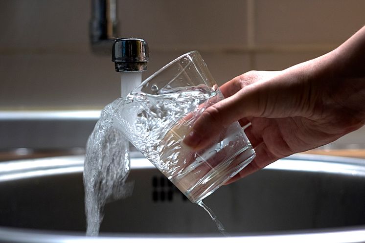 Tap water into glass_iStock-694918376_Credit-PixelsEffect.jpg