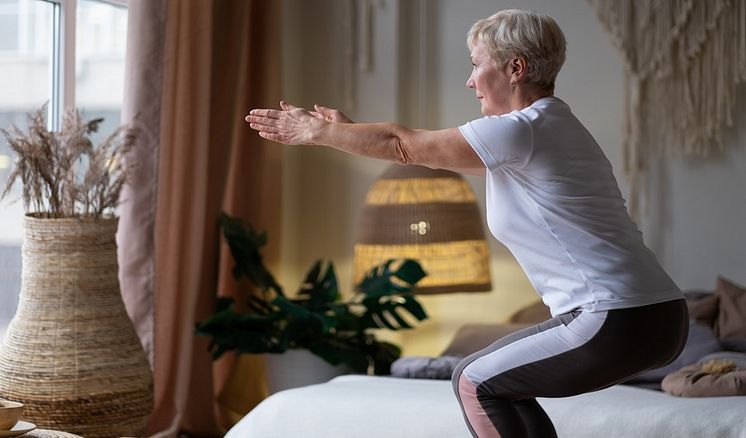 43056398-senior-caucasian-woman-practicing-advanced-yoga-chair-960x564.jpg