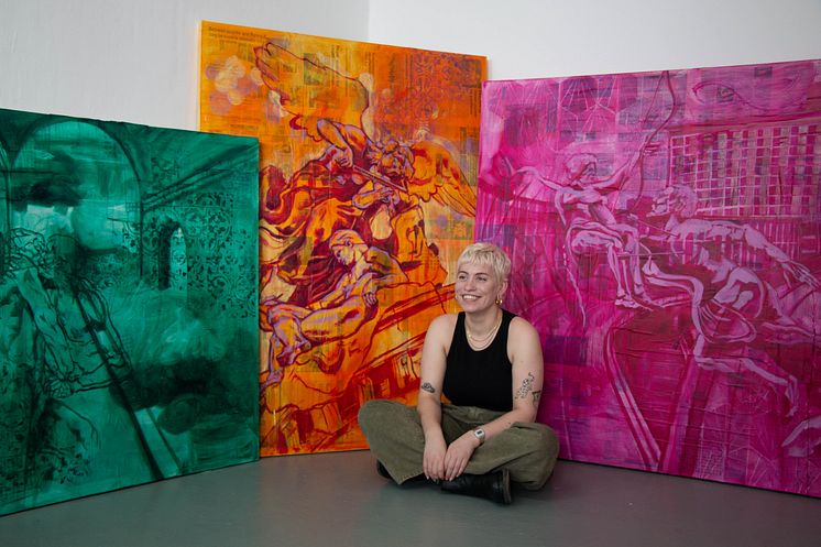 Award winning Fine Art student, Sophie Woodward, pictured with some of her paintings