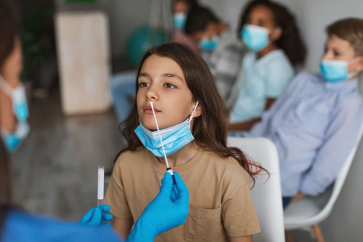 girl-getting-tested-for-coronavirus-sitting-with-c-2021-12-09-06-07-12-utc