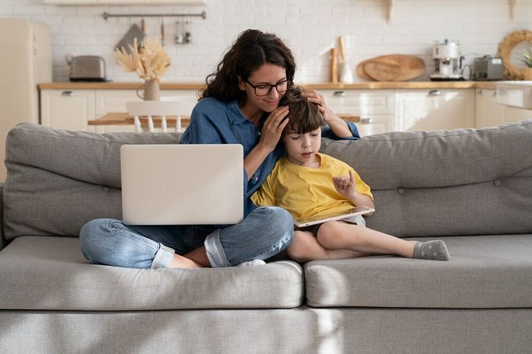 young-single-mom-freelancer-work-from-home-and-help-small-kid-with-homeschool-and-online-education-1024x682