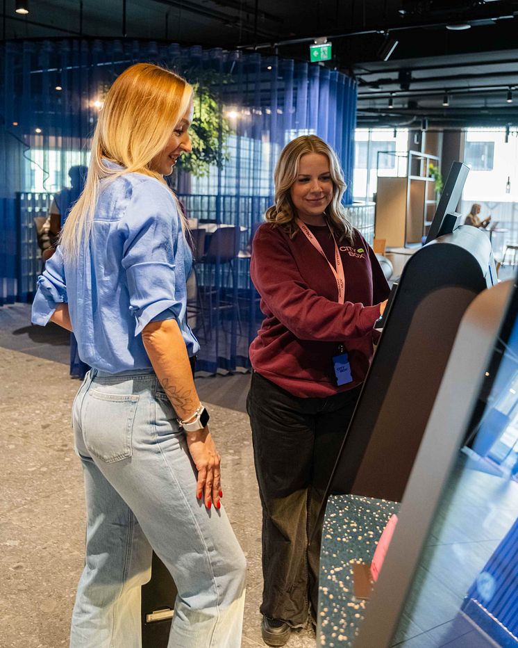 Host helping guest to check in