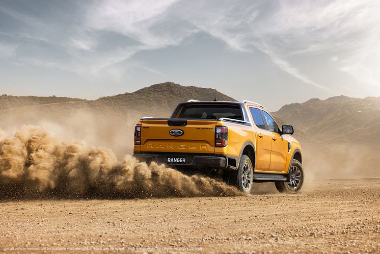 2022Ford_NextGenRanger_Wildtrak_Rear3QTR_motion_sand