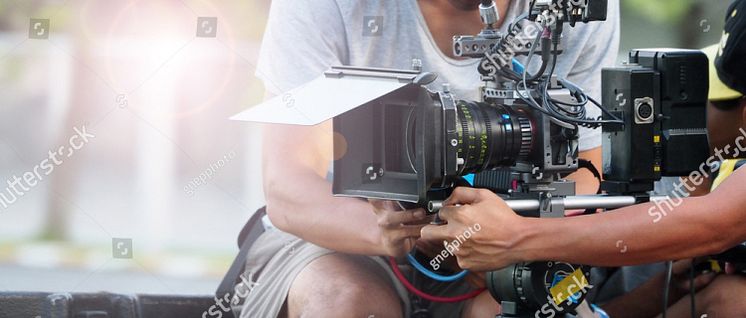 stock-photo-behind-the-scenes-of-movie-shooting-or-video-production-and-film-crew-team-with-camera-equipment-at-689286943