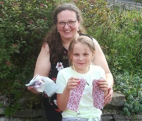 Lynn and daughter Izzy, who have been making face coverings to help protect colleagues and customers