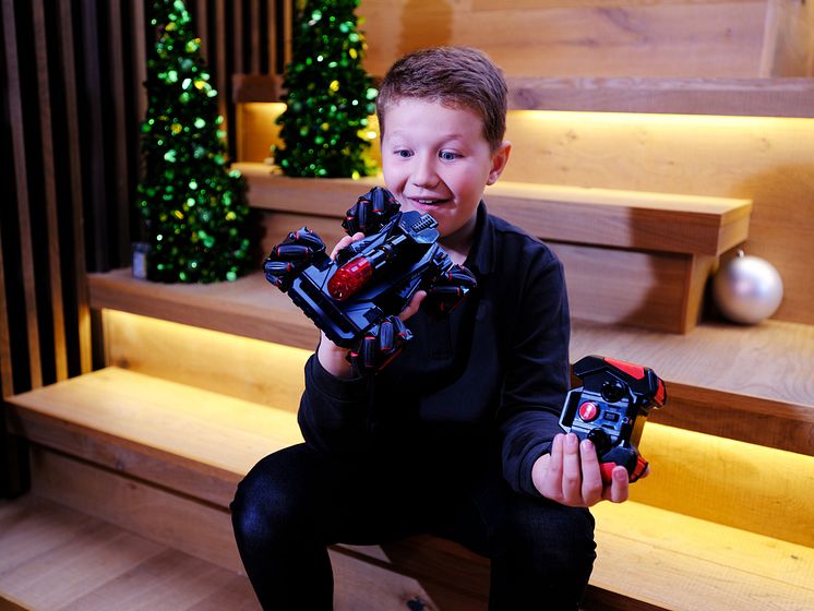 Child with Laser Battle Hunters Vehicle.JPG