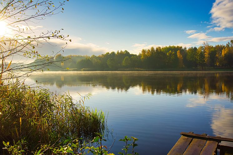50968491-sunset-over-a-tranquil-rural-lake-with-reflections-on (1)