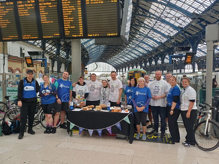 Colleagues gather following a station relay race from Eastbourne to Brighton