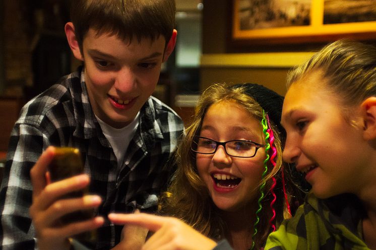 Children playing with phone - photo Kyle Mahaney.jpg