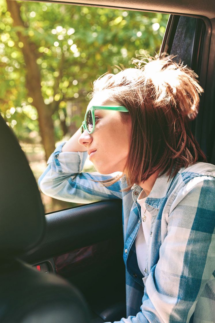 mp65118287-young-woman-looking-landscape-through-the-window-car_webb.jpg
