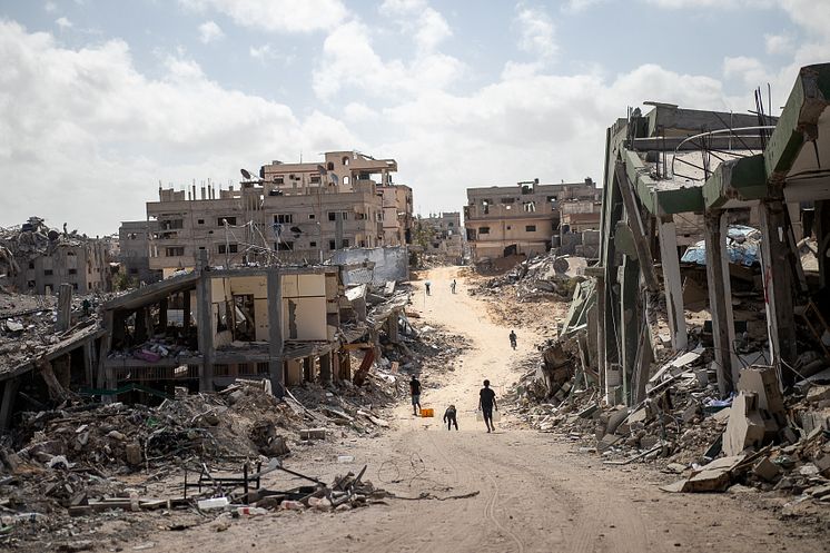 CH11031424_Children walk down the destroyed streets of Khan Younis, the Gaza Strip (1) 1.jpg