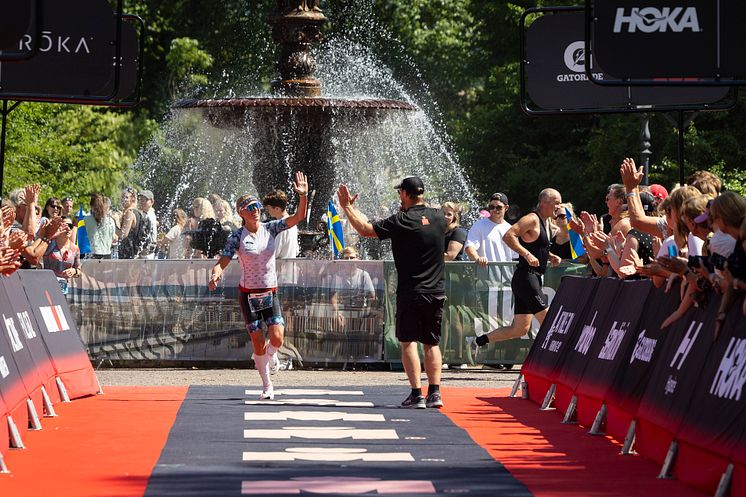 Athlete running down the red carpet_Photo by Michael Campanella - Getty Images for IRONMAN.jpg