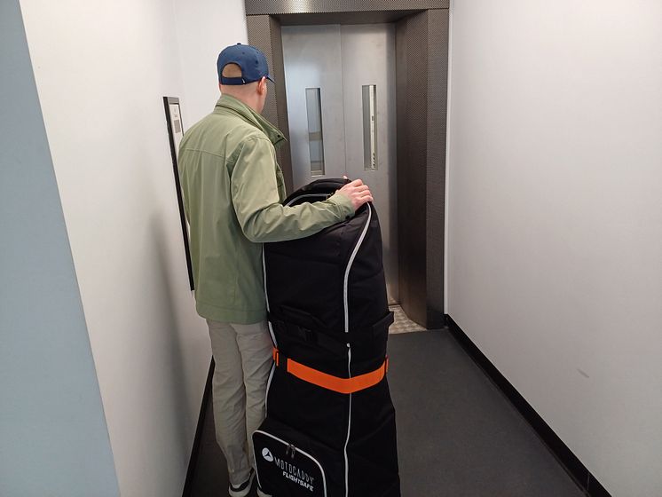 Passenger waiting for new lift at Tooting.jpg