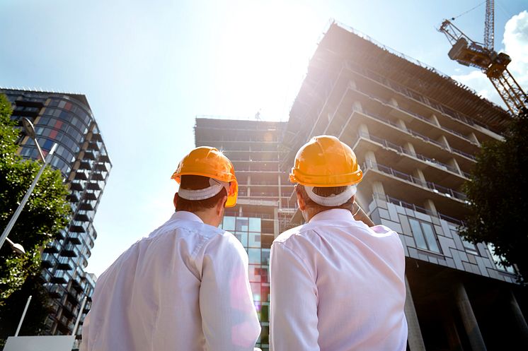 architects-hardhats-building-construction-getty-510519943.jpg