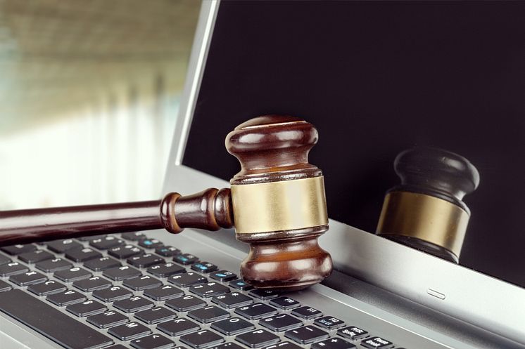 Hammer on laptop - Billion Photos_shutterstock_1182675289.jpg