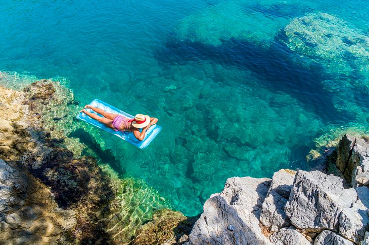 Woman-floating-sea-ocean-1046570642 (1).jpg