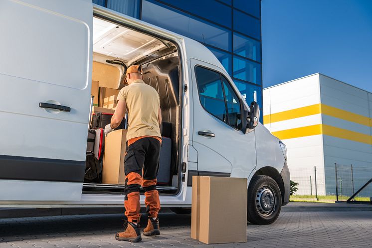 mp64844204-courier-opening-his-moving-van-door-delivering-packages.jpg
