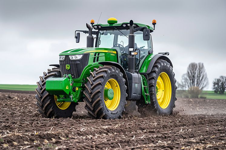 ploughing-field-with-john-deere-tractor-john-deere-was-manufactured.jpg