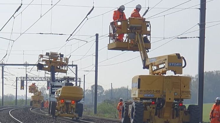 Engineers working on the overhead line